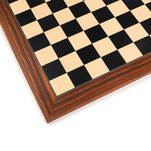 Load image into Gallery viewer, A close-up detail shot of a wooden chessboard corner highlighting light maple and dark ebony-style inlaid squares surrounded by a rich brown rosewood border.