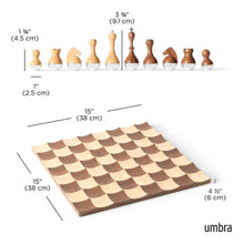 Load image into Gallery viewer, Product diagram by Umbra showing dimensions for a wobble wooden chessboard—15 inches square and 4.5 inches high—along with measurements for light and dark wooden rounded-base chess pieces.