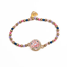 Load image into Gallery viewer, Bling Donut Spinner Bracelet. Featuring a centered figure that actually spins!