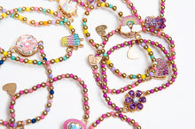 Load image into Gallery viewer, Assortment of Spinner Bracelets. Featuring whimsical charms like unicorns, rainbows, and sweets, these aren't just for looks—the center figures actually spin!