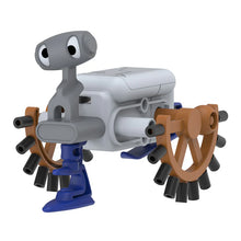 Load image into Gallery viewer, This image shows the completed "Scootz" motorized robot standing assembled against a plain white background. The quirky creature is built from a central white plastic battery body, featuring a single blue support leg at the front, a grey head with large cartoonish googly eyes, and two spoked brown wheels lined with black rubber pegs to crawl forward.