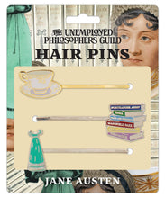 Load image into Gallery viewer, Set of three literary-themed bobby pins featuring a teacup, stacked books, and a Regency dress.
