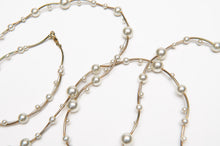 Load image into Gallery viewer, Pearl Strand designed with staggered, multi-sized pearls on a fine gold-finish framework