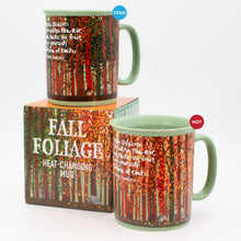 Load image into Gallery viewer, A demonstration highlights the heat-changing mug next to its packaging, showing how the forest design transitions from green summer trees when cold to vibrant autumn foliage when filled with hot liquid.