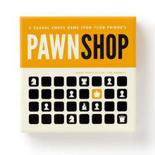 Load image into Gallery viewer, The front cover of the "Pawnshop: A Casual Chess Game (For Your Fridge)" box, featuring yellow and off-white colors with graphic chess icons.