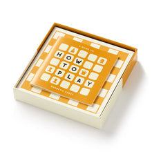 Load image into Gallery viewer, An open box displaying a yellow-and-white checkered magnetic chessboard base alongside a "How to Play Magnetic Chess" instruction booklet.