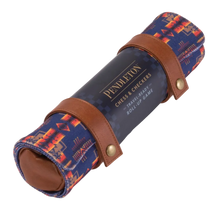 Load image into Gallery viewer, A Pendleton roll-up travel chess and checkers set wrapped in a dark blue branded label and bound by brown leather snap straps.