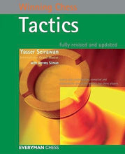 Load image into Gallery viewer, Front cover of the book "Winning Chess Tactics" by Yasser Seirawan with Jeremy Silman, framed in green and featuring a top-down close-up photo of a wooden rook's crenellations bathed in warm lighting.