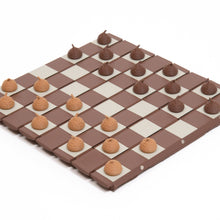 Load image into Gallery viewer, Light brown and dark brown acorn-shaped pieces are arranged across a segmented, wood-textured board for a game of checkers.