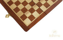 Load image into Gallery viewer, A close-up detail shot of the inlaid wood squares, outer border, and brass latch of a folding wooden chessboard.
