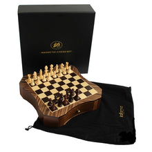 Load image into Gallery viewer, A set up magnetic wooden chessboard resting on a black Italfama brand cloth storage bag next to its black presentation box.