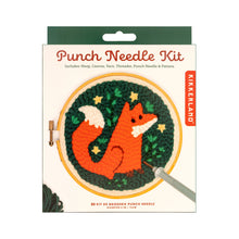 Load image into Gallery viewer, This retail box for a Kikkerland "Punch Needle Kit" features a woodland theme and is topped with a dark forest-green hanging tab. The white packaging prominently displays an illustration of a textured, completed project showcasing a bright orange fox surrounded by tiny yellow stars on a deep green background, all framed inside a six-inch wooden hoop.