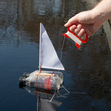 Load image into Gallery viewer, This kit includes everything you need to make your own sailboat, complete with a sail, mast, and rudder.