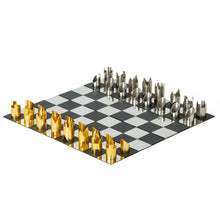 Load image into Gallery viewer, A complete modern chess set with stylized gold and silver tubular pieces arranged on a reflective black-and-silver checkered board against a white background.