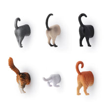 Load image into Gallery viewer, six individual, unpackaged cat butt magnets arranged neatly in two rows of three, viewed from behind as if they are walking into a wall. The top row features a grey cat, a tan Siamese, and a solid black cat with upright tails, while the bottom row showcases a fluffy calico, a low-profile white cat, and a striped orange tabby with a playfully curled tail.