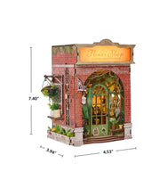 Load image into Gallery viewer, The complete miniature flower shop book nook is displayed with dimension markings indicating a height of 7.40 inches, a depth of 3.94 inches, and a width of 4.53 inches.