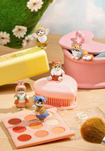 Load image into Gallery viewer, Five small cat figurines dressed in land-animal costumes like a rabbit, koala, and red fox, playfully posed around pastel vanity items. They are arranged across a wooden tabletop alongside an open eyeshadow palette, a pink heart-shaped brush, a yellow cosmetic container, and a soft green artificial plant.