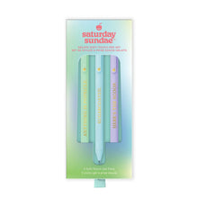 Load image into Gallery viewer, a rectangular box with a pastel green and blue gradient background that displays the "Saturday Sundae Gelato Soft-Touch Pen Set." Inside a cutout window shaped like a classic popsicle on a stick, three gel pens in mint green, light blue, and lavender are neatly lined up, each stamped with an inspirational gold message.