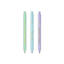 Load image into Gallery viewer, Against a plain white background, three retractable ballpoint pens are arranged vertically side-by-side in a neat row. From left to right, the pens are a soft pastel green, a light pastel blue, and a gentle pastel purple, with each barrel featuring a positive phrase printed vertically in gold lettering: "MATCHA WAITING FOR?", "STAY CHILL.", and "SPRINKLE KINDNESS."