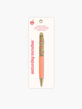 Load image into Gallery viewer, "Saturday Sundae Cherry Smiles Floaty Ballpoint Pen" has a warm peach-colored lower barrel, polished gold trim at the tip and clip, and a clear upper chamber filled with sparkling gold glitter fluid where small pink cherry icons float up and down.
