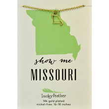Load image into Gallery viewer, This image shows a gold-finished metal keychain packaged against a clean white card that features a grey stitched border. The keychain consists of a round, split key ring holding a solid metal charm that is uniquely shaped like the state of Missouri, with a small heart stamped into the center.