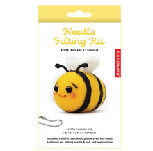 Load image into Gallery viewer, A finished "Needle Felting Kit" project. on the packaging is a small, round, hand-crafted wool bumblebee with a bright yellow body, black stripes, two tiny white wings, rosy pink cheeks, and a stitched sweet smile.