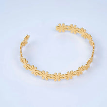 Load image into Gallery viewer, 24K Gold-Filled Floral Bangle blends delicate botanical artistry with a rich, radiant golden finish
