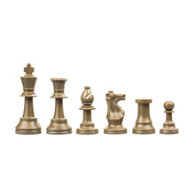 Load image into Gallery viewer, A line of metallic bronze-gold plastic chess pieces set against a white background, arranged in height order from king to pawn.