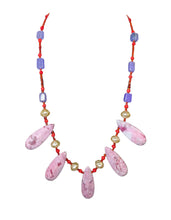 Load image into Gallery viewer, This handcrafted statement necklace features five teardrop-shaped, marbled pink gemstone pendants arranged along the front, separated by lustrous cream pearls and bright red seed beads on a strand that extends into rectangular lavender beads.