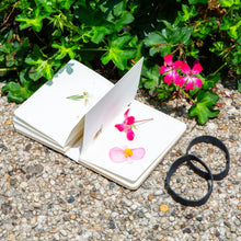 Load image into Gallery viewer, Portable accordion-style flower press, features elastic bands to securely press and preserve your botanical finds.