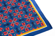 Load image into Gallery viewer, This is a blue pocket square featuring an intricate repeating pattern of red shields containing black chess king pieces interspersed with standalone king silhouettes, all bordered by a yellow and white frame with a solid blue edge.