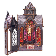 Load image into Gallery viewer, A gothic, castle-like wooden miniature dioramas opens to reveal an illuminated throne room complete with a red throne, glowing crystal brazier, and a back wall rendered like a dragon-themed stained glass window.