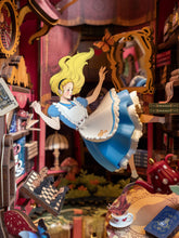 Load image into Gallery viewer, A close-up view focuses on the central miniature Alice figure mid-air surrounded by falling playing cards, a floating chessboard, and a red polka-dot teapot pouring into a tiny teacup.