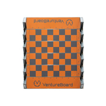 Load image into Gallery viewer, A top-down view of an unfolded VentureBoard mini travel chess set featuring an orange-and-grey checkered board with rank and file notation.