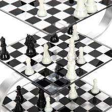 Load image into Gallery viewer, A close-up view of a multi-tiered, three-dimensional chess set with black and white pieces arranged across transparent, checkered glass levels supported by a curved metal frame.