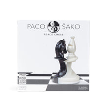 Load image into Gallery viewer, Front packaging box for "Paco Sako Peace Chess" featuring an illustration of interlocking black and white chess pieces.