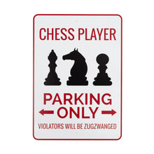 Load image into Gallery viewer, This white novelty parking sign has a thin red border and features red text at the top reading "CHESS PLAYER" above black silhouettes of three chess pieces: a bishop, a knight, and a pawn. Below the graphics, bold red text states "PARKING ONLY" flanked by left and right arrows, ending with the witty warning "VIOLATORS WILL BE ZUGZWANGED."