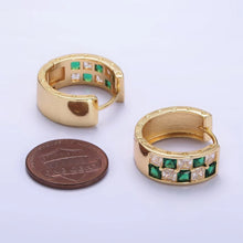 Load image into Gallery viewer, These gold-toned huggie hoop earrings are slightly larger then a US penny. 
