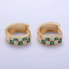 Load image into Gallery viewer, 24K Gold-Filled Huggies featuring a high-contrast checkered design set with sparkling clear and emerald green pavé Cubic Zirconia. Featured on the side are tiny star engravings along the top and bottom metal edges.
