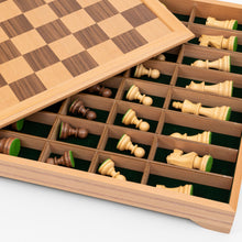 Load image into Gallery viewer,  French Staunton Knight Style pieces in storage compartment below board
