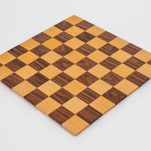 Load image into Gallery viewer, Every board is handmade from walnut/maple locally sourced from the St. Louis area. Each board is finished off with top of the line hard wax oil. Features a borderless design and 2.5" squares.
