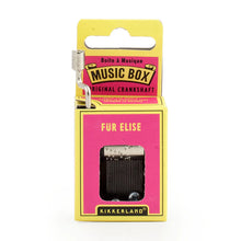 Load image into Gallery viewer, This image shows a small, hand-cranked music box packaged in a bright yellow and hot-pink cardboard box with a hang-hole at the top. A silver metal crank extends from the upper left side, and a rectangular window on the front reveals the internal gear mechanism right below the title "FÜR ELISE".
