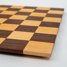 Load image into Gallery viewer, Every board is handmade from walnut/maple locally sourced from the St. Louis area. Each board is finished off with top of the line hard wax oil. Features a borderless design and 2.5" squares.
