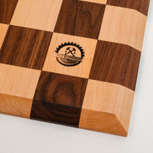 Load image into Gallery viewer, Every board is handmade from walnut/maple locally sourced from the St. Louis area. Each board is finished off with top of the line hard wax oil. Features a borderless design and 2.5" squares.
