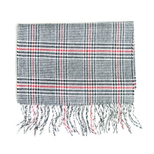 Load image into Gallery viewer, Black and white houndstooth scarf with a subtle red overcheck grid and fringe.
