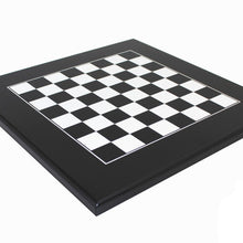 Load image into Gallery viewer, An angled perspective view of the high-gloss black and white chessboard resting on a plain white background with the Italfama watermark in the bottom corner.
