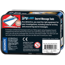 Load image into Gallery viewer, This image shows the back of a rectangular "Spy Labs Incorporated" storage tin, featuring a dark blue background filled with detailed instructions, safety information, a barcode, and a 0-3 age restriction warning. On the left side, a prominent bright red panel spotlights a clean illustration of the kit's contents, showing the two capped marker pens resting neatly on top of the open paper notepad next to the circular mixing dish and slender brush pen.

