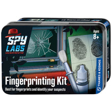 Load image into Gallery viewer, This image features the front of a small, rectangular storage tin for a children's spy activity set titled "Fingerprinting Kit," designed for ages 8 and up under the "Spy Labs Incorporated" brand. The box art depicts a suspenseful, illustrated scene of a broken window glass with a large fingerprint lifted from it, right next to an up-close graphic of a gray dusting brush and a small bottle of fingerprint powder.
