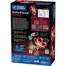 Load image into Gallery viewer, This image displays the back of the "SolarFlower Ruby Ripple" packaging box, which features a detailed, dark breakdown of the engineering kit's features, diagrams of the building plastic frames, and a prominent illustration of a green solar panel collecting light to power the flower's movement. The bottom section includes a bright blue banner highlighting that the STEM educational kit contains 114 pieces, alongside necessary regulatory labels, age warnings, and a square QR code to view the sculpture moving.
