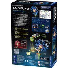 Load image into Gallery viewer, This image shows the back of the "SolarFlower Sapphire Swirl" packaging box, featuring a detailed dark layout that showcases the kit's components, instructional steps, and plastic building parts. On the lower half, a vibrant illustration demonstrates a green solar panel catching beams of light to fuel the mechanical rotation of the blue-petaled flower structure.

